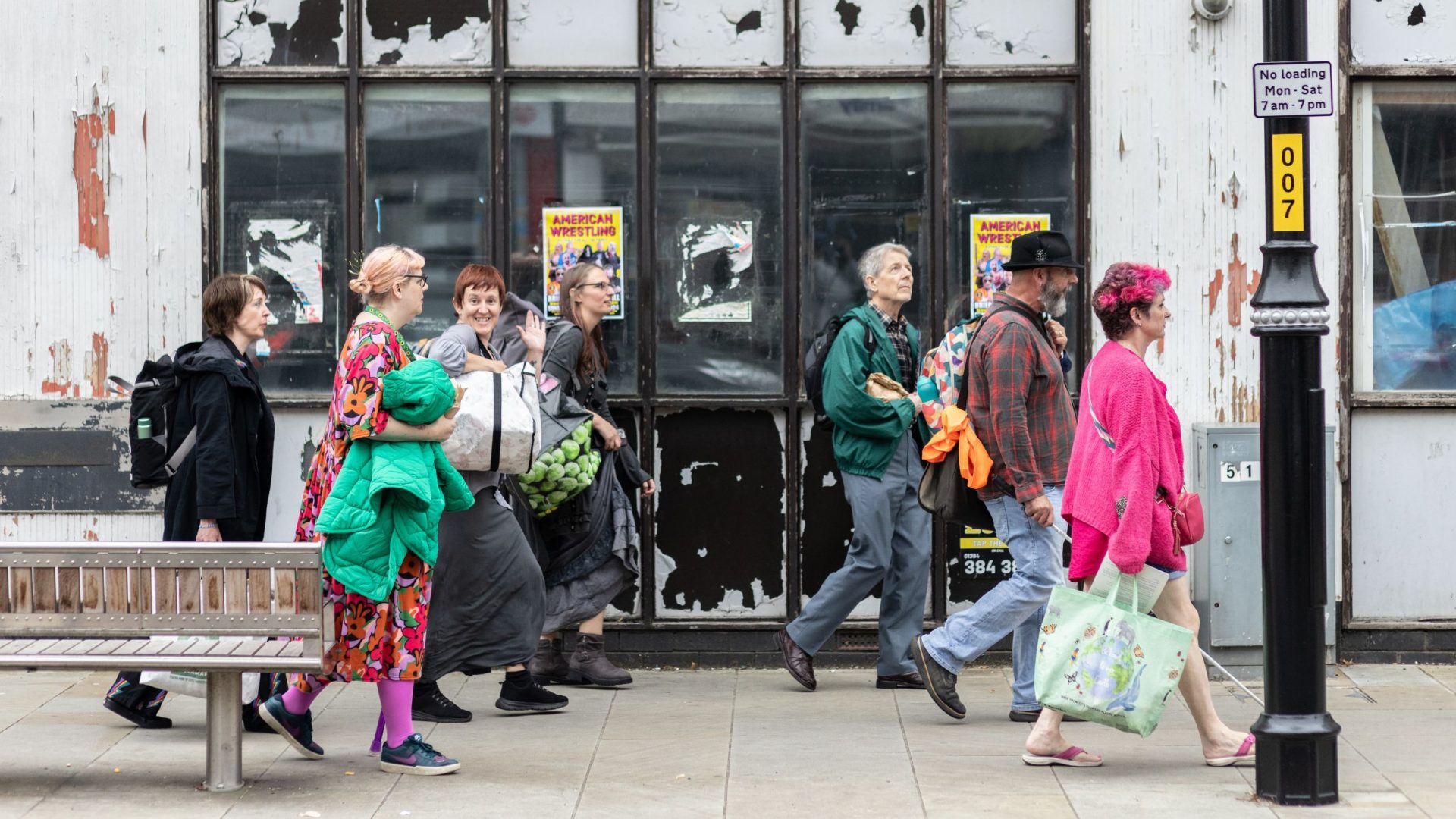 Participants of the Phoenix Project, Brierley Hill walk through the street.