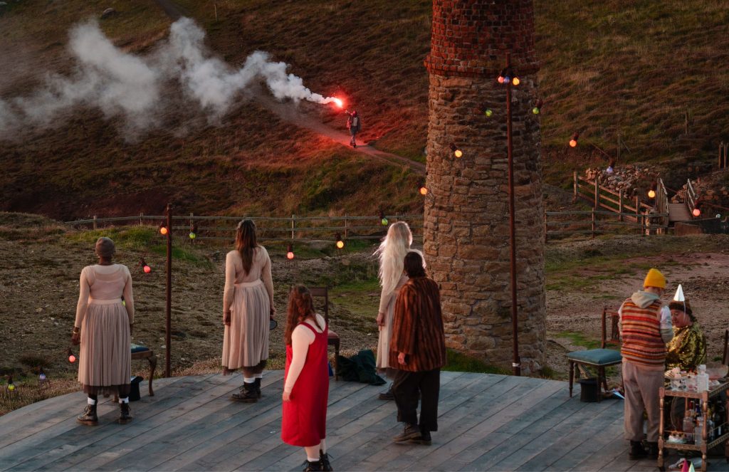 A Stranger arrives carrying a flare. Stranger Beasts by Wildworks