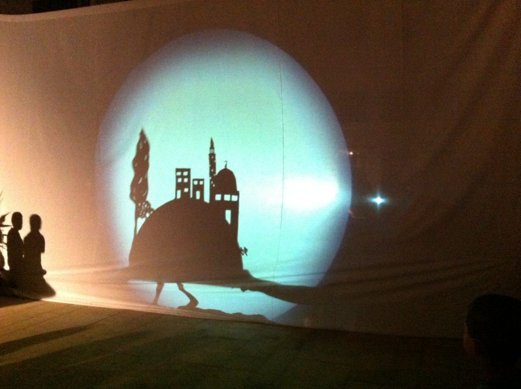 Shadow display projected onto wall. Nablus, City of Stories by Wildworks