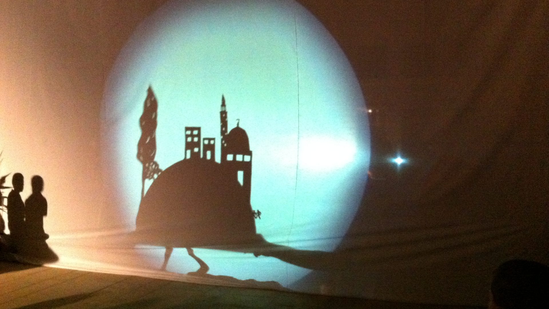 Shadow display projected onto wall. Nablus, City of Stories by Wildworks