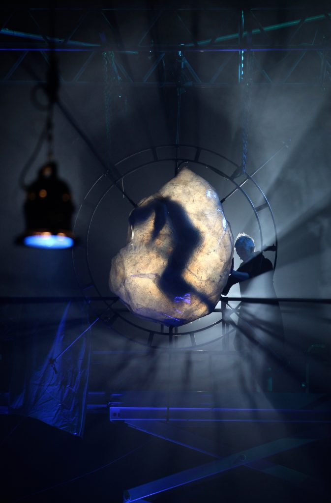 A iceberg with a frozen beehive and body in it. A Beautiful Journey by Wildworks
