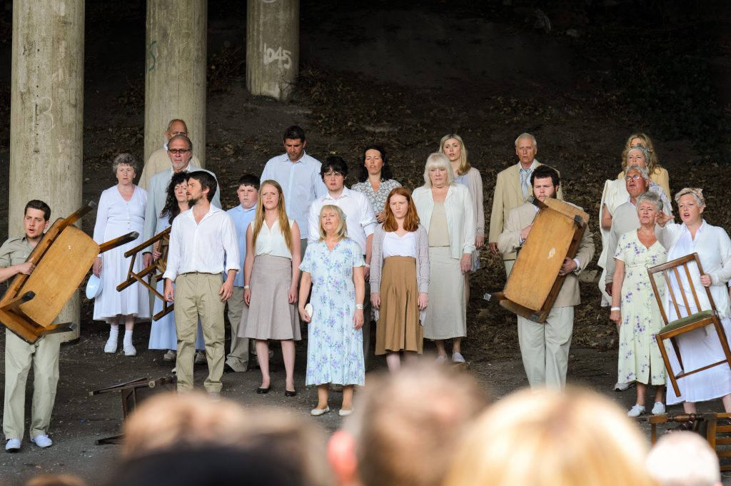 A group of performers under the M4 bridge.
