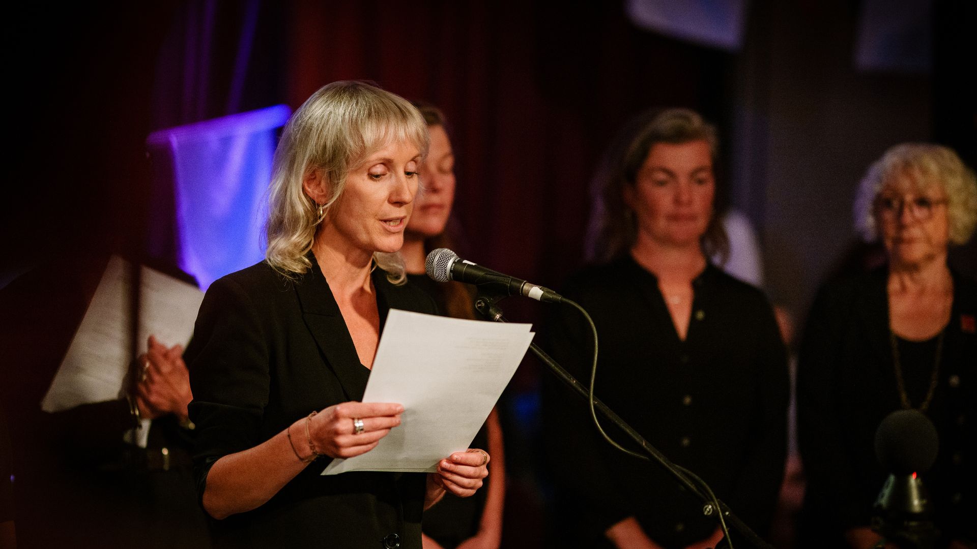 Agnieszka Blonska reads a poem during From West Cornwall to the West Bank by Wildworks.