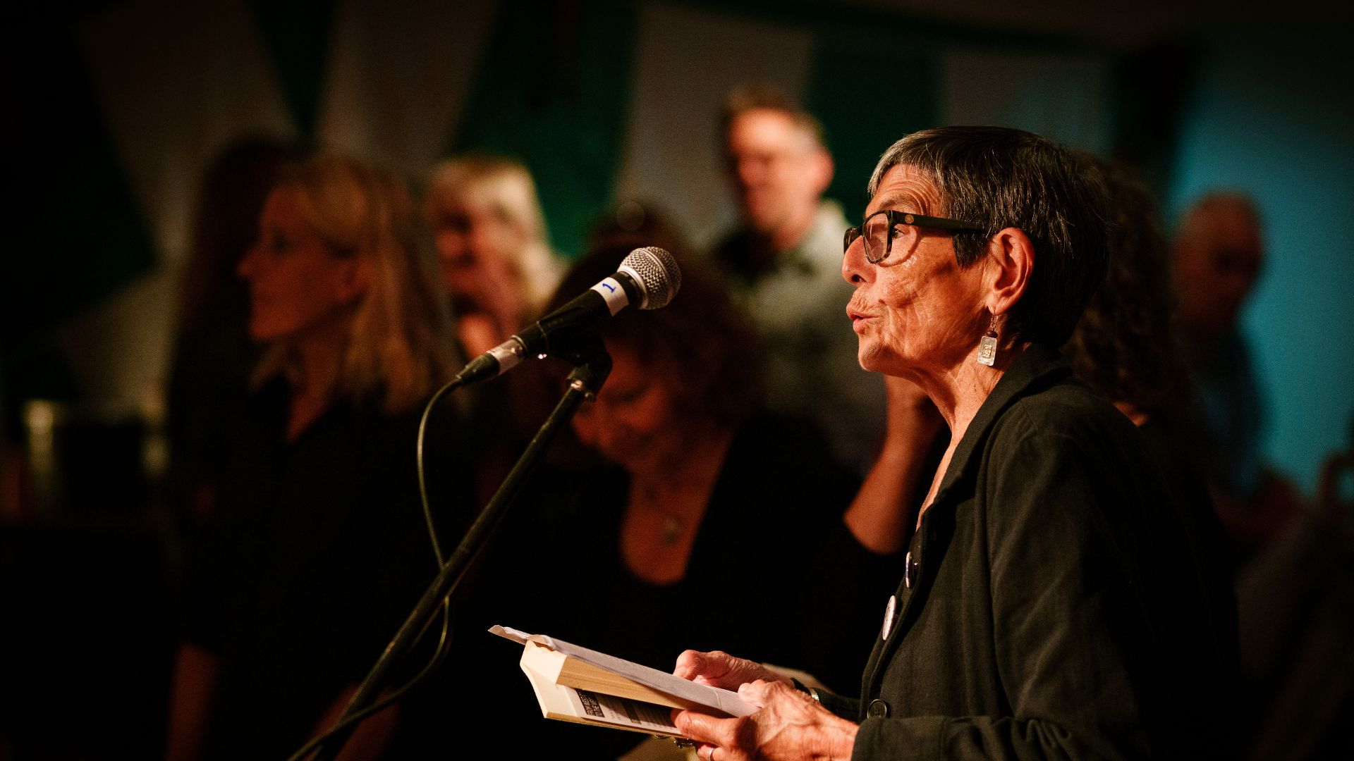 Mercedes Kemp reading during From West Cornwall to the West Bank by Wildworks.
