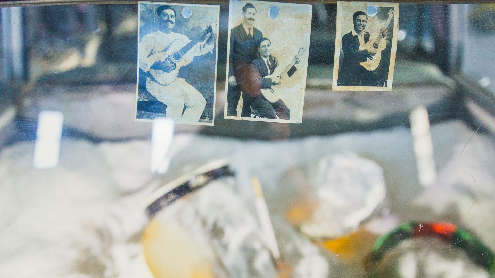 Installation of old photos of musicians. Arrow of time set in Malta Aviation Museum in Ta' Qali with Wildworks and Etnika, Magna Żmien, Buena Sombra Films